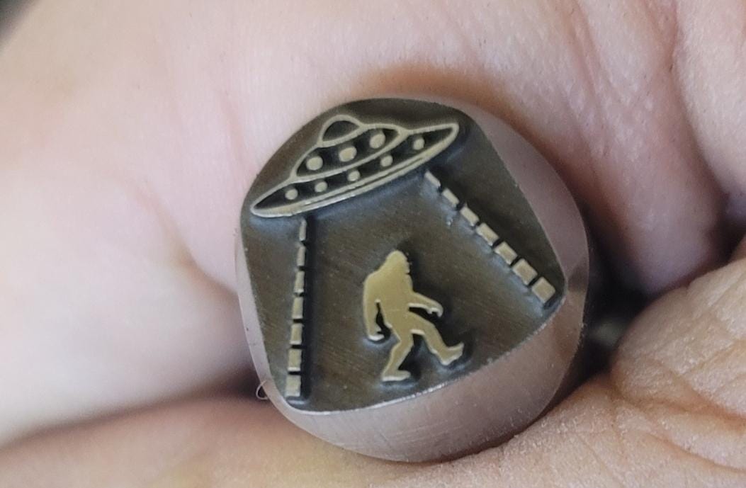 Sasquatch abducted by Aliens - Metal Stamp